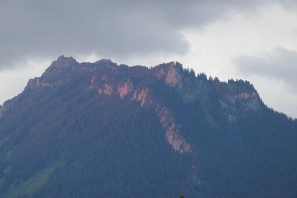 Sigriswiler Rothorn with red glow on its rockfaces.