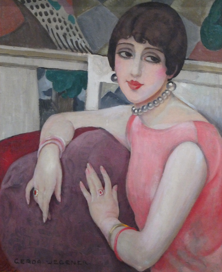 An Art Deco portrait. A woman, Lili Elbe, with striking features and dark hair in a stylish bob, sits against a purple cushion. Her eyes look off to the viewer's upper right. She wears a pink sleeveless dress, bangle bracelets, a pearl choker, and earrings; her makeup is full 20s style with cupid's bow lips. The chair or sofa she sits in is red, and is against a multicolored backdrop. The portrait is fairly suggestive and erotic. Elbe was a trans woman, and a few years later would undergo one of the first gender-affirming surgeries.