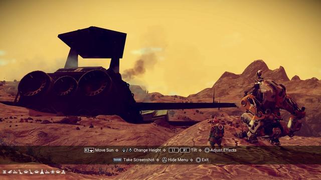 Rugged desert landscape with yellow sky. A space-suited alien stands next to a mech unit on a hill overlooking the remains of a crashed freighter.