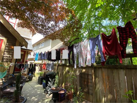 clothes on two crossing clotheslines in a breeze