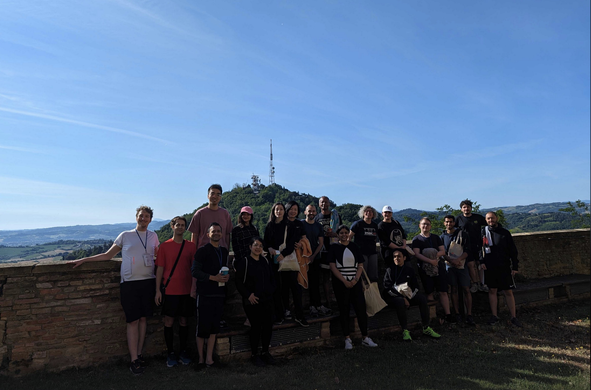 ISWS 2024 participants on the balcony of Bertinoro castle with a view and with tutor Jan Christoph Kalo on the left.