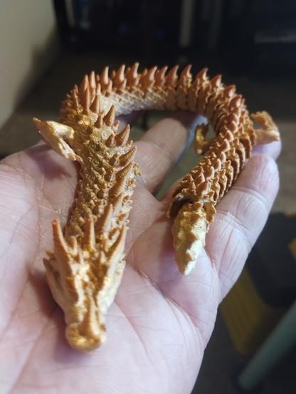 gold(ish)  ice dragon printed with rainbow PLA.