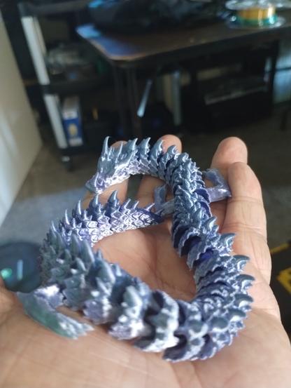 blue(ish)/purple(ish)  ice dragon printed with rainbow PLA.