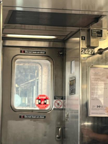 Photo of the inside of an nyc subway car. I didn’t feel comfortable taking closeups of random folks sweating bullets in the train. So instead trust me that on the 1 train car 2427 is HOT