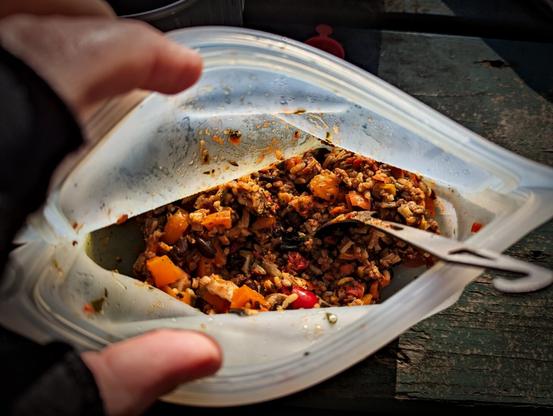 a stasher with a meal of rice and veggies