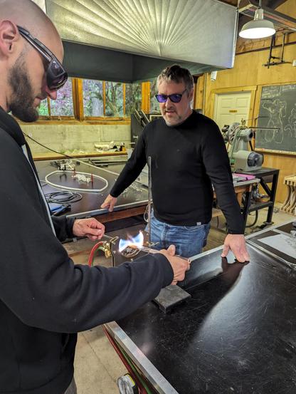 Brian letting Justin test out the torch.