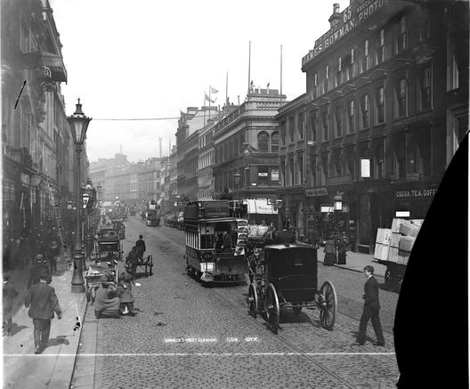 Black and white photo of a late Victorian street scene.
