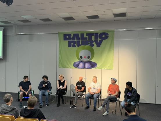 Seven rubyists discussing on stage