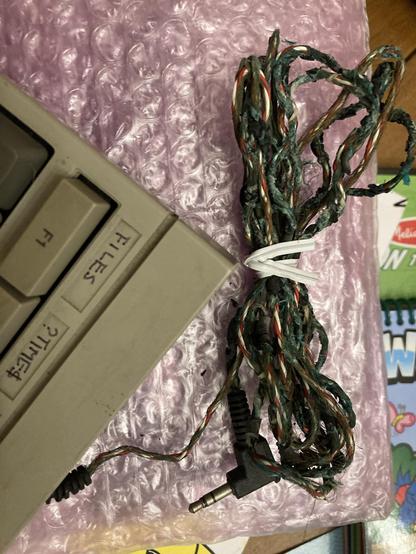 The old keyboard cable, whose insulation is a disintegrating mess