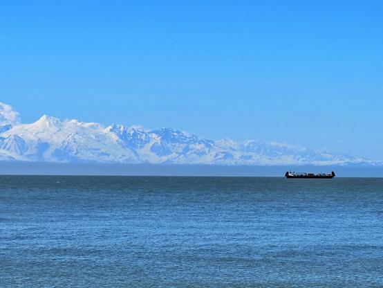 A barge in front of Mt. Spurr in Cook Inlet today. Photo taken from the beach.