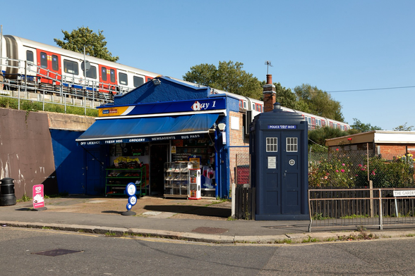 Composite of a police box on a residential street