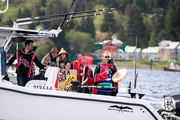From 2022 Wild Salmon Flotilla Protest - to protect wild salmon & call for no more open net fish farms in BC waters.
We are in NHL Canucks' Willie Mitchell's boat. With Chief Ernest Alfred of Namgis Nation & his family. We have several protest signs & the Chief is drumming & singing.