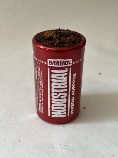 Serious corrosion of the positive terminal on an Everest D-Cell pulled from a vintage multimeter. Surprised to measure 1.4 volts.