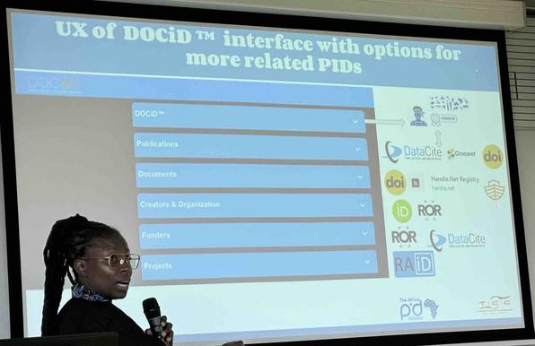 Screenshot of presentation slide breaking down sections of a Digital Object Container Identifier (DOCiD) metadata record, connecting to publications, documents, creators and organizations, funders, and projects.