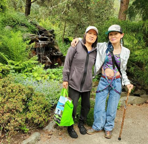 Me & my Mom in front of gardens waterfall.
