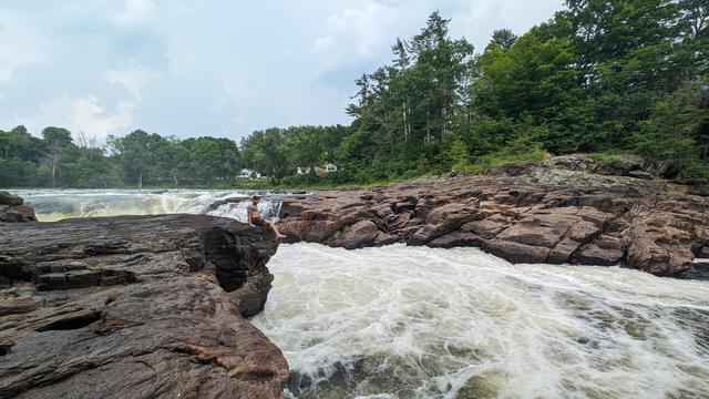 photo of Johnny (himbo) sitting by the waterfall