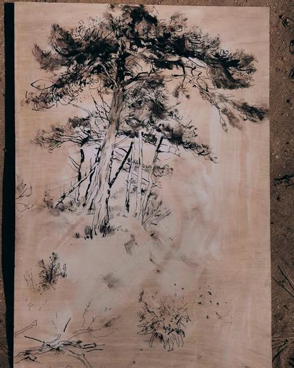 Ink painting of a tree on wood panel.