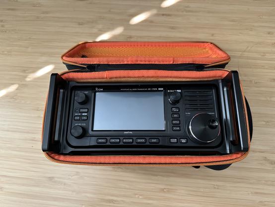 An Icom IC-705 in an ARK cage in a case.