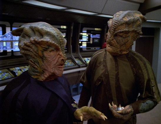 Two reptillian aliens on the Voyager bridge.