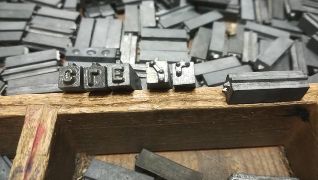 Photograph of a Braille-Latin "double side" metal type font.