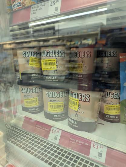 A Waitrose freezer full of tubs of Smugglers ice cream which optimistically announce they have "hidden parsnip", all with reduced price yellow stickers