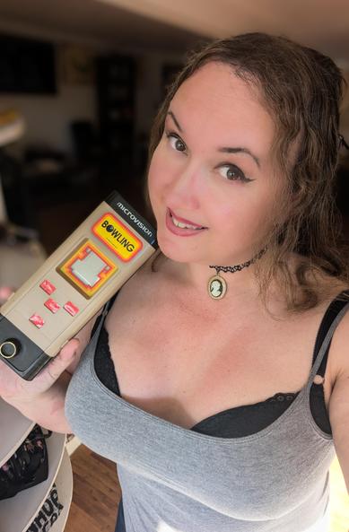 Me posing with a Microvision with the bowling cartridge in it.