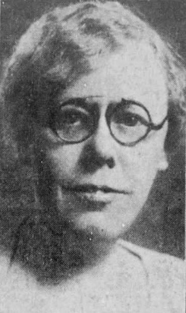 Winnifred Wygal, from a 1935 newspaper; a white woman with grey hair cut short, wearing round eyeglasses