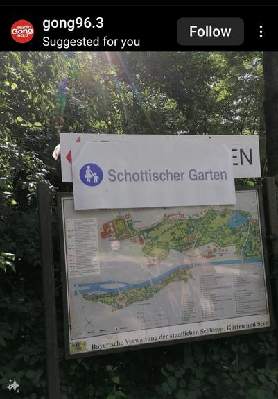 A sign saying schottischer garten placed over the englischer garten in Munich
