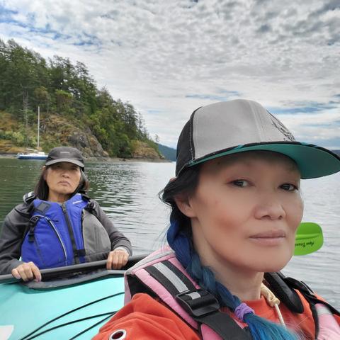 Selfie of me & my Mom in a double sea kayak, on the ocean. Mom is in rear steering seat.