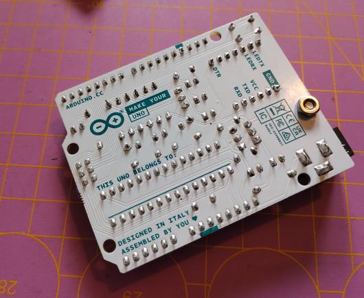 the back side of the Arduino Uno, showing my soldering