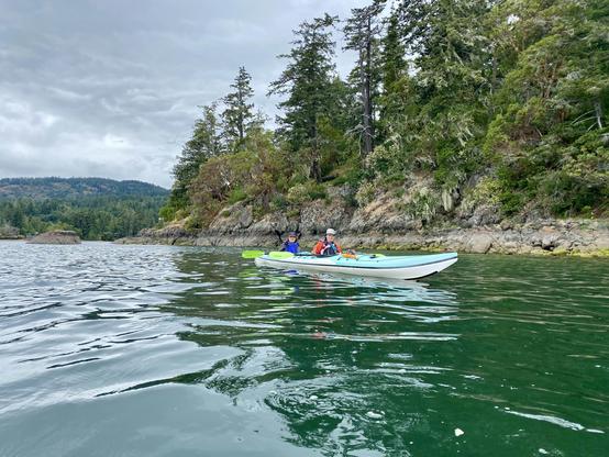 Me & Mom on the ocean, in a turquoise blue, tandem sea kayak.