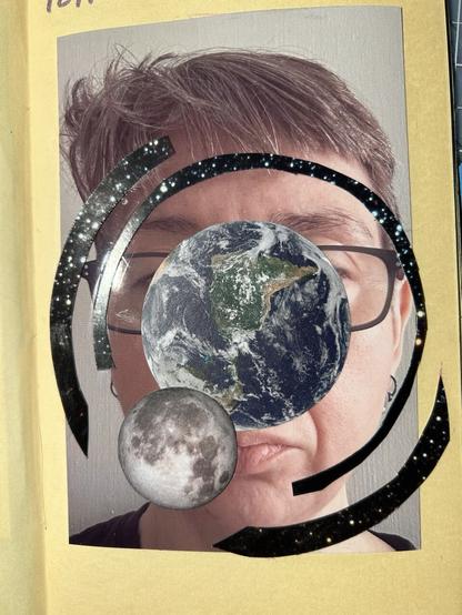 An image of a white woman’s face pasted into a sketchbook. She is white woman with short brown hair and rectangular glasses with dark frames. On her face are collaged images of the earth and moon, with arcs of starry sky around them.