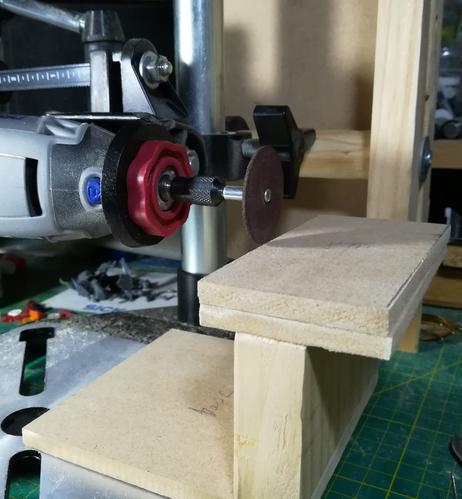 Closer view of the dremel tool and the wooden sled.