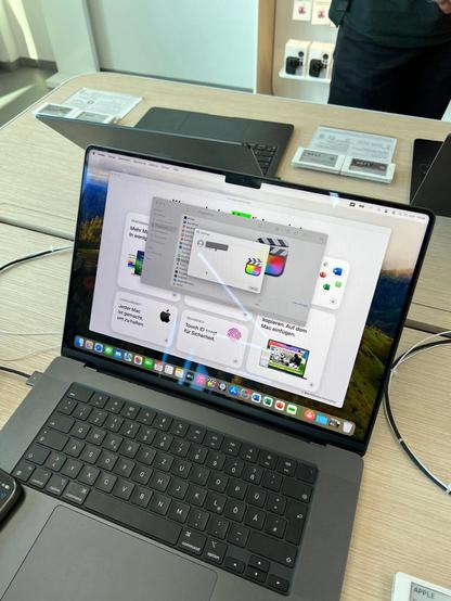 picture of a macbook pro display unit airdropping final cut pro to an iphone