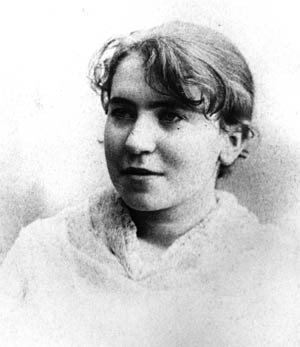 Emma Goldman in 1886, smiling, monochrome