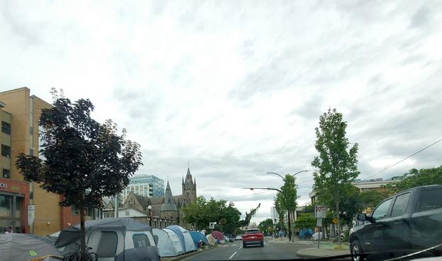 Tents along boulevard on Pandora St.