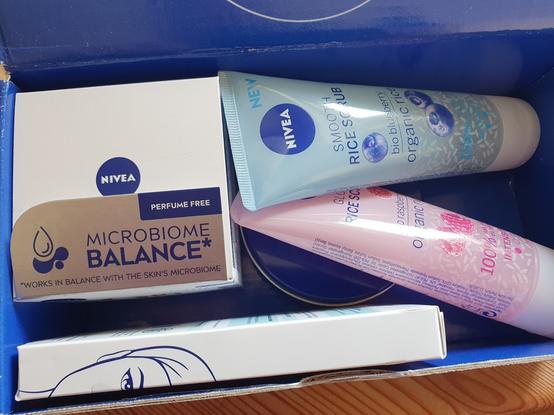 A blue cardboard box with skincare products.