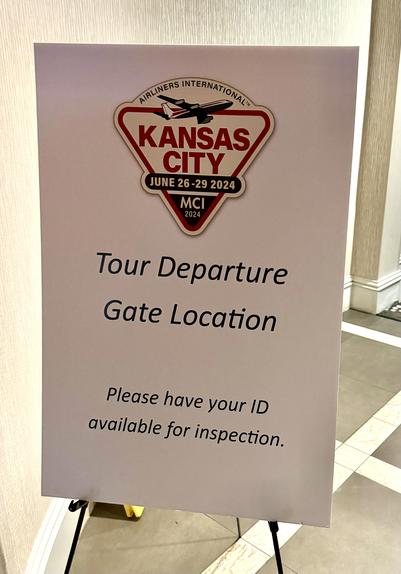 Sign posted at the entrance reads: Tour Departure
Gate Location
Please have your ID available for inspection.