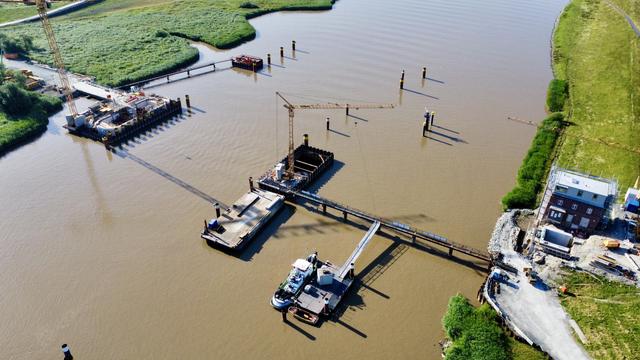 Drone shot from 100m. A lot of impressive foundations are visible. No bridge though.