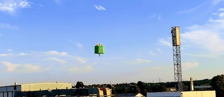 A picture of a flying Uber Eats shopping bag over Fischenich