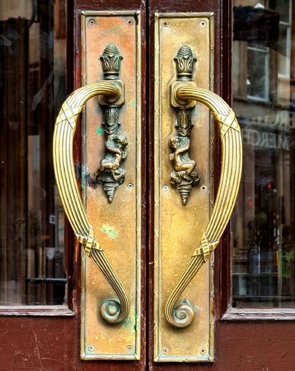 A pair of brass late Victorian Art Nouveau door pulls.
