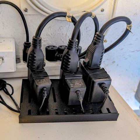 The wall wart organizer device in use.