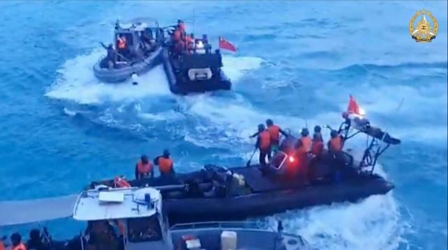 Chinese coast guard personnel wielding knives, sticks and an axe surrounded and boarded three Philippine navy boats on June 17 during a resupply mission to Second Thomas Shoal.