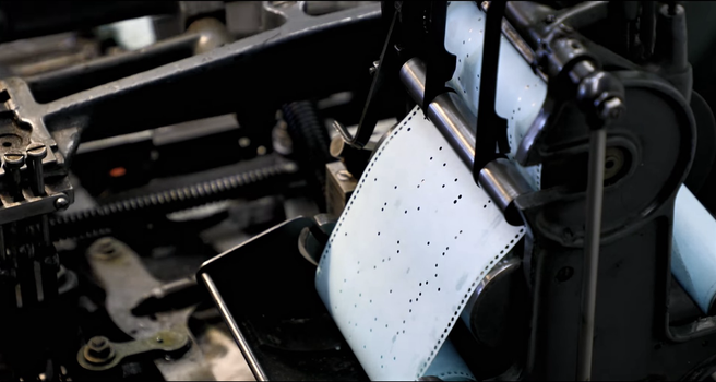 Paper spool, Monotype composition caster