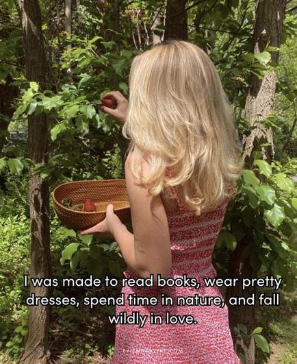 Woman picking strawberries from a tree. Yes, tree!