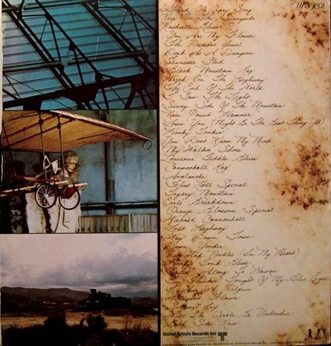 The art of the back cover is split into 4 parts, 3 photos in a column on the left, and a handwritten tracklisting on the right. The 1st photo is a closeup of some architectural detailing, perhaps of a building's ceiling with metal struts; the 2nd has part of an old hang glider showing, with a large stone angel statue behind it; the last is a cloudy landscape. The tracklisting side looks like old paper that's been burned/soiled.