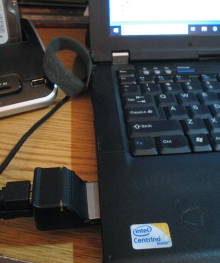an Sonnet Tempo SATA Express Card 34 in action, inserted into a Lenovo ThinkPad R400 connecting a hard drive dock with a hard drive inserted.