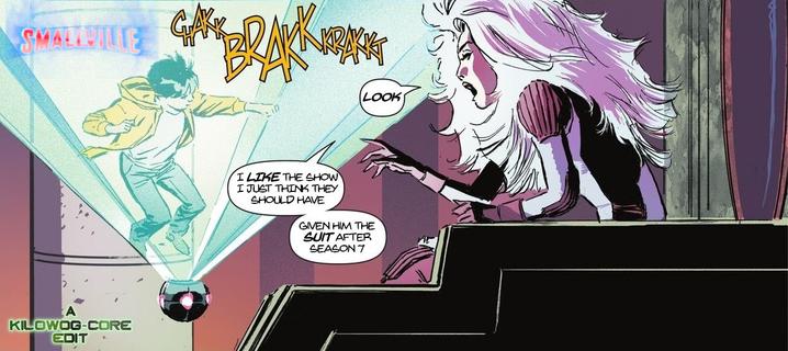 In a comic panel Glyanna, a white-haired alien, is watching a hologram of a young Jonathan Kent punching things. Jon wears a hoodie and jeans, and looks like a teenage Superman. A logo for the TV show Smallville gleams in the hologram. Glyanna says, "Look, I like the show, I just think they should have given him the suit after season 7." A caption reads, "A Kilowog-core Edit".