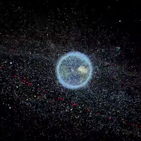 An illustration showing Earth in the centre on a black background, surrounded by space debris.