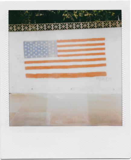 A polaroid shot taken this morning of street art on a white-painted cinderblock retaining wall. The street art is an American flag - a bit faded by the shitty instant film that has been sitting in my camera for 3 months... so the red strips are a bit orangey. 

There is a story, often told, that upon exiting the Constitutional Convention Benjamin Franklin was approached by a group of citizens asking what sort of government the delegates had created. His answer was: "A republic, if you can keep it."

Happy 4th of July, everyone.